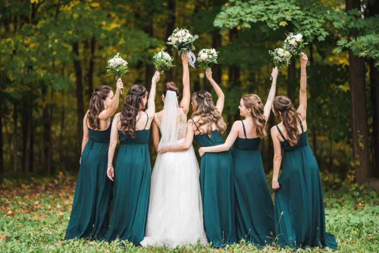 Bridesmaids have fun with bouquets
