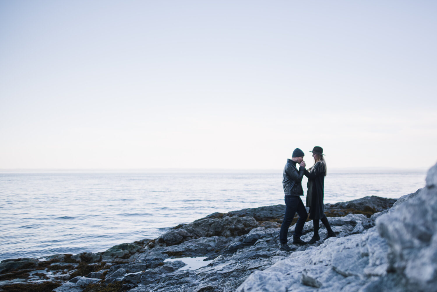 couple on the rocks with an incredible panorama