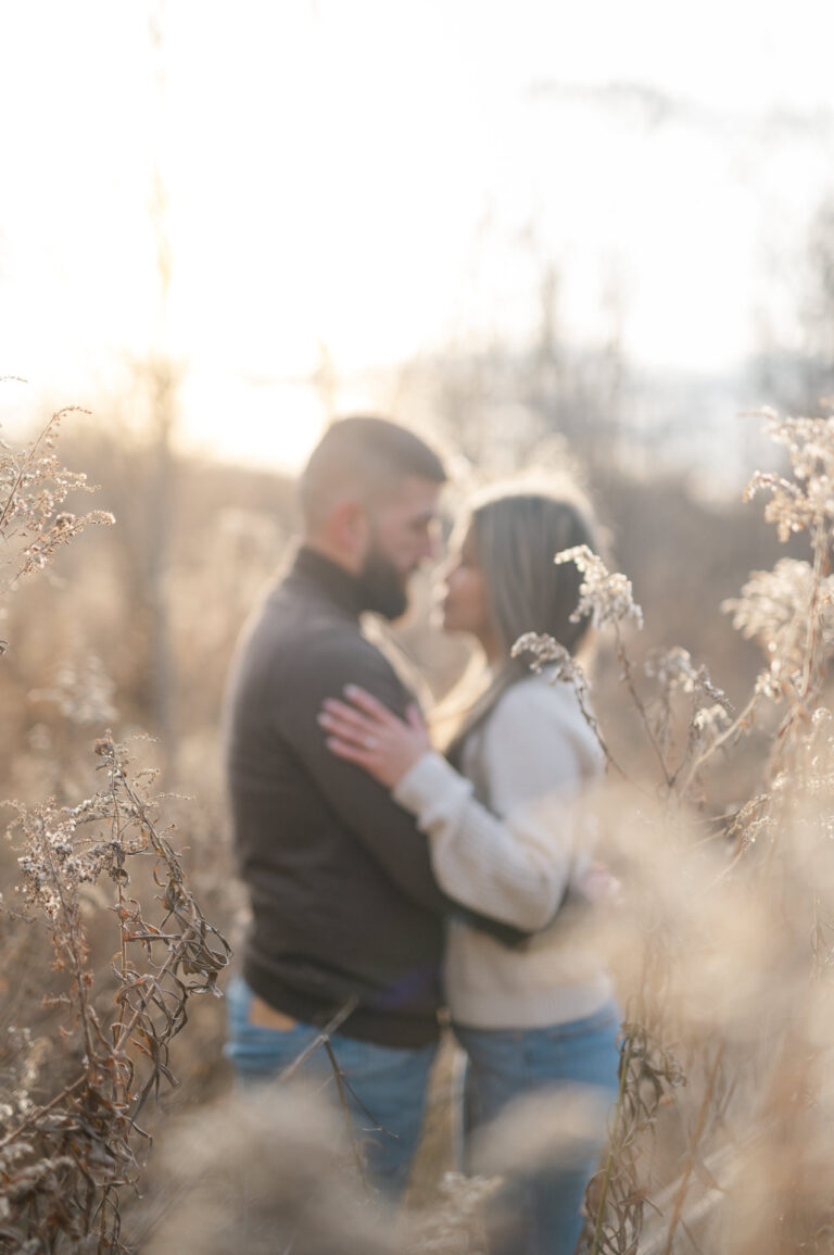 Couple blurred in a field for an engagement session